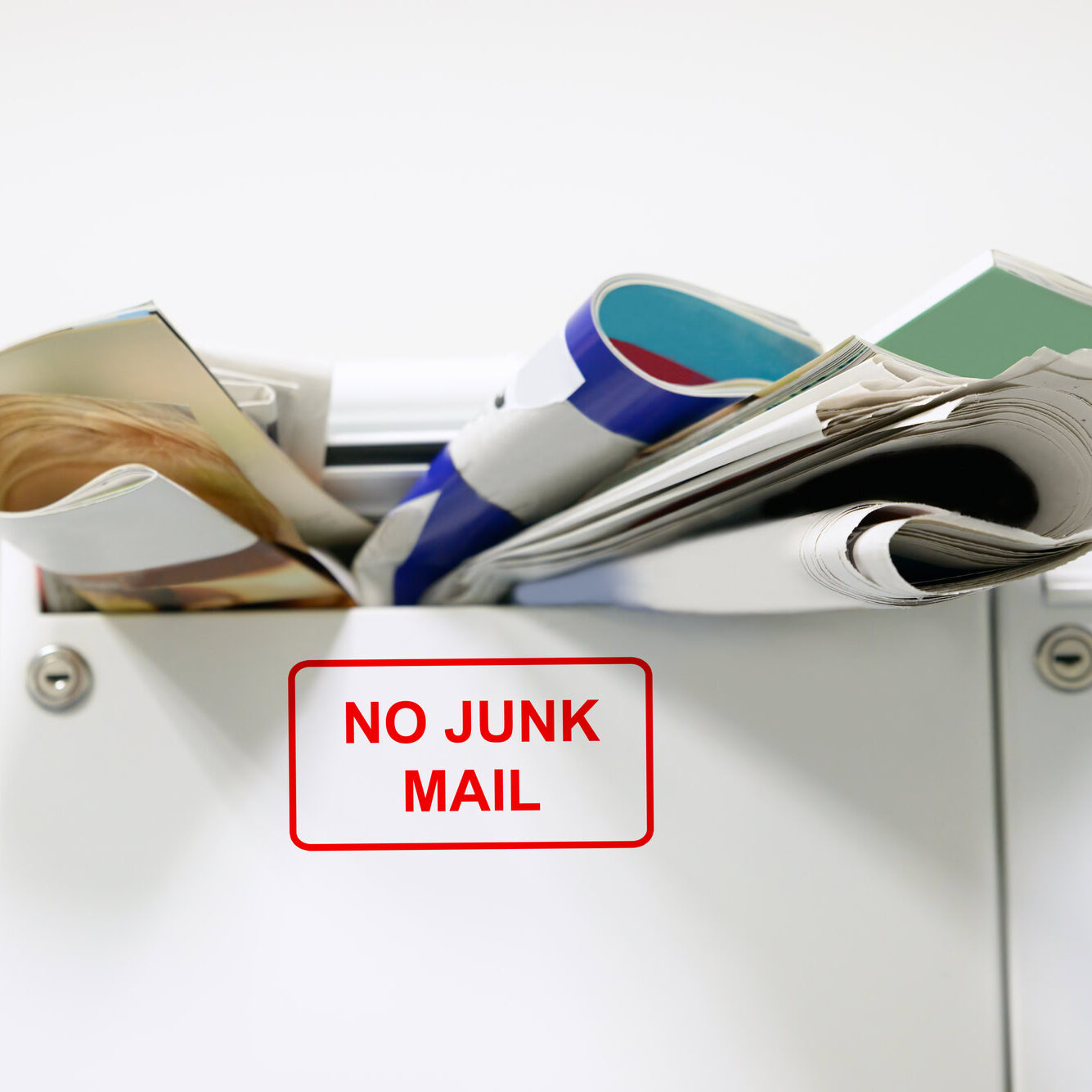 Close-up Of Mailbox Overloaded With Junk Mail